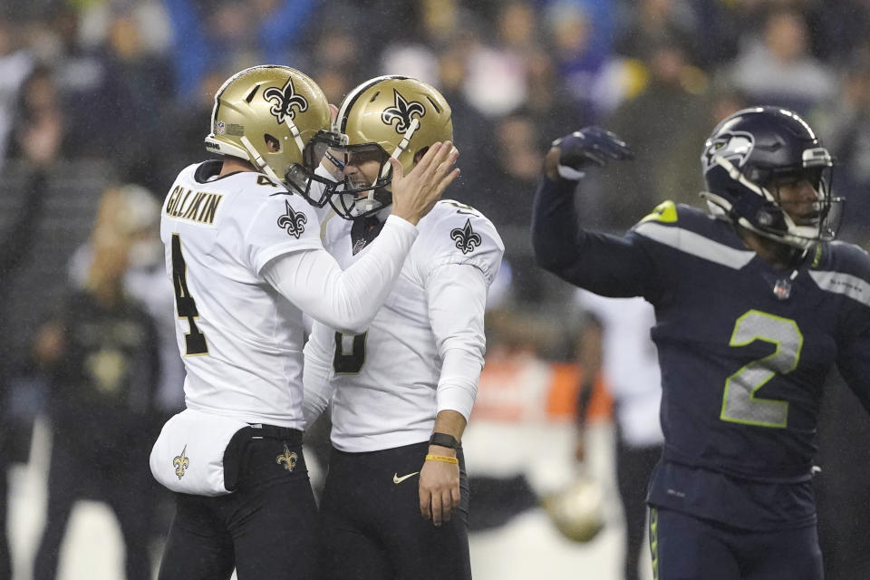 New Orleans Saints' Brian Johnson, center, is congratulated by Blake Gillikin after kicking a 33-yard field goal against the Seattle Seahawks late in the second half of an NFL football game, Monday, Oct. 25, 2021, in Seattle. (AP Photo/Ted S. Warren)