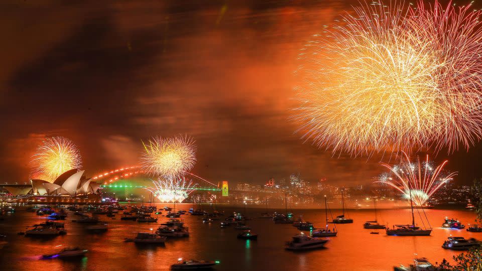 Fireworks light up the sky over the Sydney Harbour Bridge during New Year's Eve celebrations on December 31, 2022 in Sydney, Australia. - Roni Bintang/Getty Images