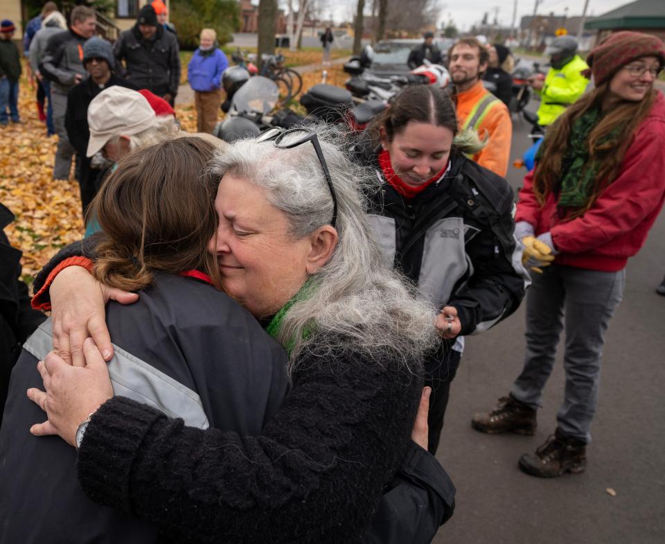 Bridget McCutchen, 22, is hugged by her mother, Eileen, after returning from a round-the-world trip on her motorcycle that started in August 2022.