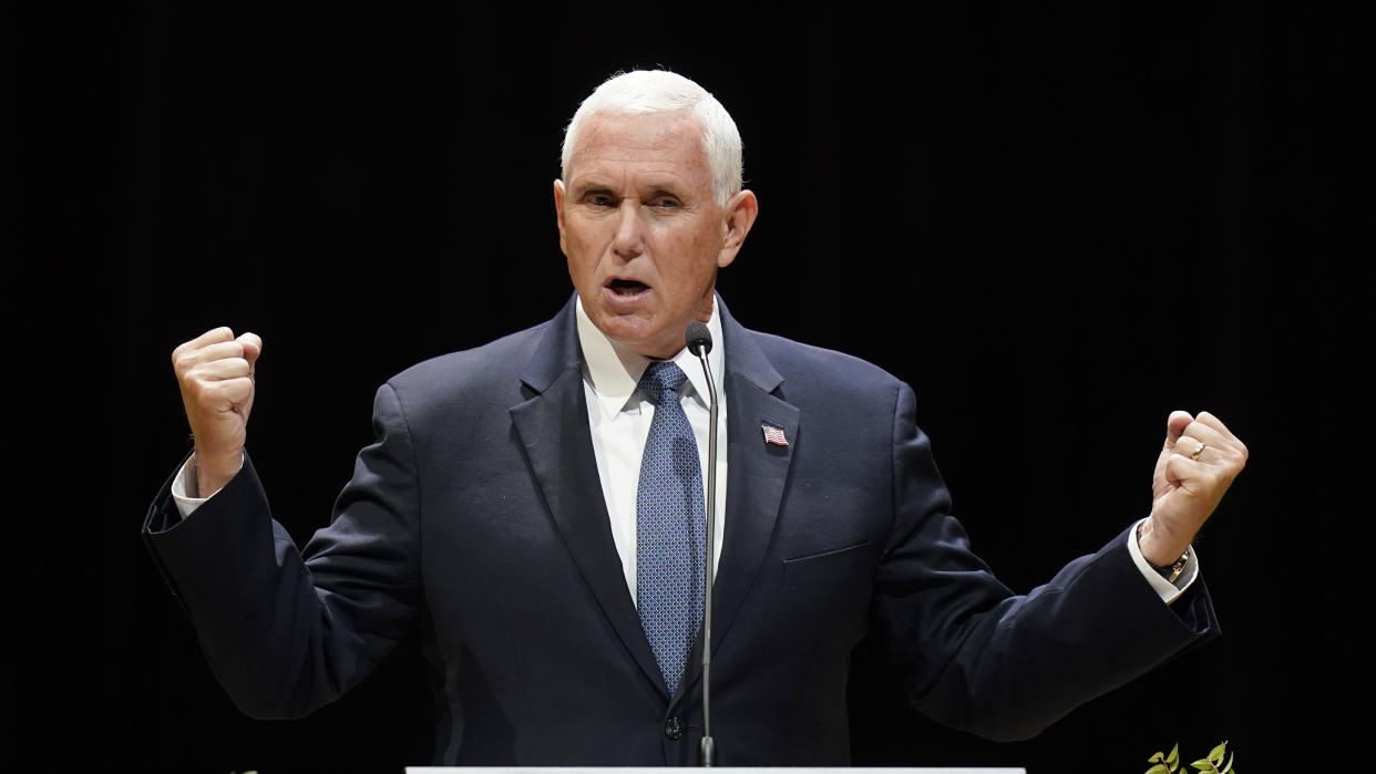 Former Vice President Mike Pence gestures as he addresses the Gary R. Herbert Institute for Public Policy on the campus of Utah Valley University Tuesday, Sept. 20, 2022, in Provo, Utah. (AP Photo/Rick Bowmer)