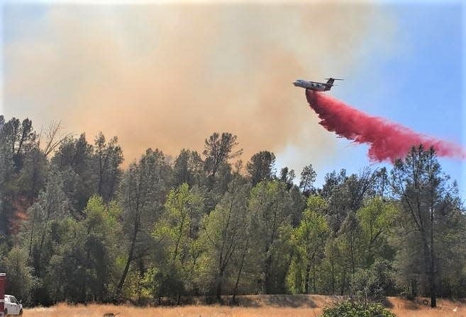 An air tanker drops retardant on the Branstetter Fire in south Redding on Sept. 1, 2022.