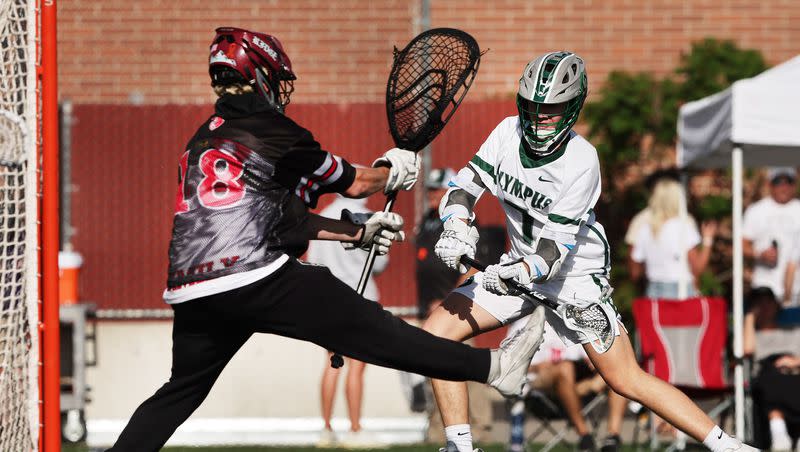 Olympus’ Cole Cummings, shoots and scores on Northridge’s goalie Callum Dibble, as they play in semifinal lacrosse action at Westminster in Salt Lake City on Wednesday, May 24, 2023.