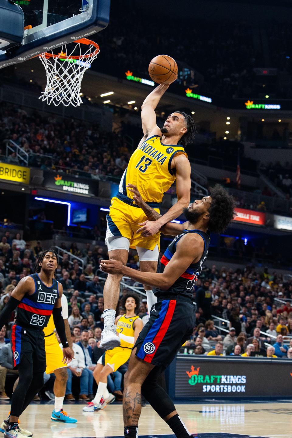 Apr 7, 2023; Indianapolis, Indiana, USA; Indiana Pacers forward Jordan Nwora (13) shoots the ball while Detroit Pistons forward Marvin Bagley III (35) defends in the first quarter at Gainbridge Fieldhouse. Mandatory Credit: Trevor Ruszkowski-USA TODAY Sports
