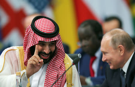 Saudi Arabia's Crown Prince Mohammed bin Salman speaks with Russia's President Vladimir Putin during the opening of the G20 leaders summit in Buenos Aires, Argentina November 30, 2018. REUTERS/Sergio Moraes