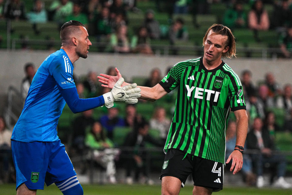 Austin FC goalkeeper Brad Stuver, left, congratulates Kipp Keller for blocking a shot during Saturday night's season-opening loss at home to St. Louis City SC, an MLS expansion team. Keller received unexpectedly high minutes because of an injury to starting center back Julio Cascante.