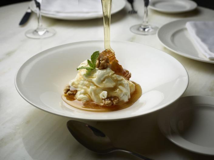 <p>A Greek yogurt dessert is a great any time of the year, but especially in the spring and following a delicious Easter meal. The traditional way to serve it is topped with chopped walnuts and thyme honey, as shown here by Chef Jesse Maldonado of <a href="https://www.cosmopolitanlasvegas.com/restaurants/estiatorio-milos" rel="nofollow noopener" target="_blank" data-ylk="slk:Estiatorio Milos" class="link ">Estiatorio Milos</a>. As one of nature’s miracle foods, honey, which provides a valuable source of antioxidants and phytonutrients, pairs perfectly with Greek yogurt, making for a delightful and nutritious dessert perfect for the holiday.</p>