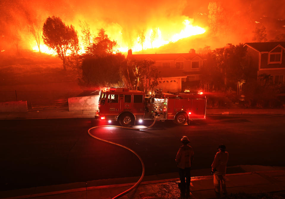 The out-of-control Woolsey Fire rages behind a house in the West Hills neighborhood of Los Angeles, Nov. 9, 2018. (Photo: Kevork Djansezian/Getty Images)