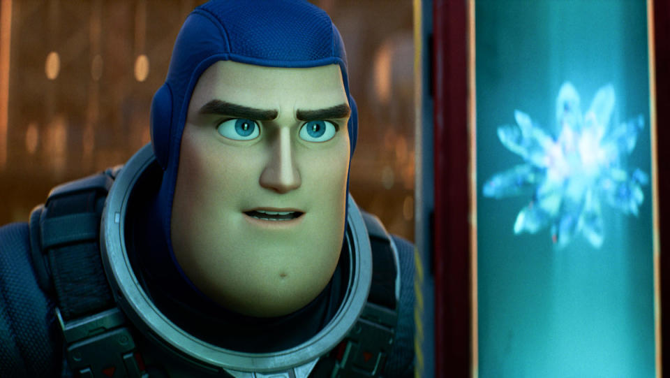 Buzz Lightyear, voiced by Chris Evans, looks at a crystal