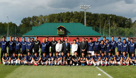 Soccer Football - World Cup - Japan Training - Japan Training Camp, Kazan, Russia - June 21, 2018 Japan's Princess Takamado poses for a picture with Japan's players and staff during training REUTERS/John Sibley