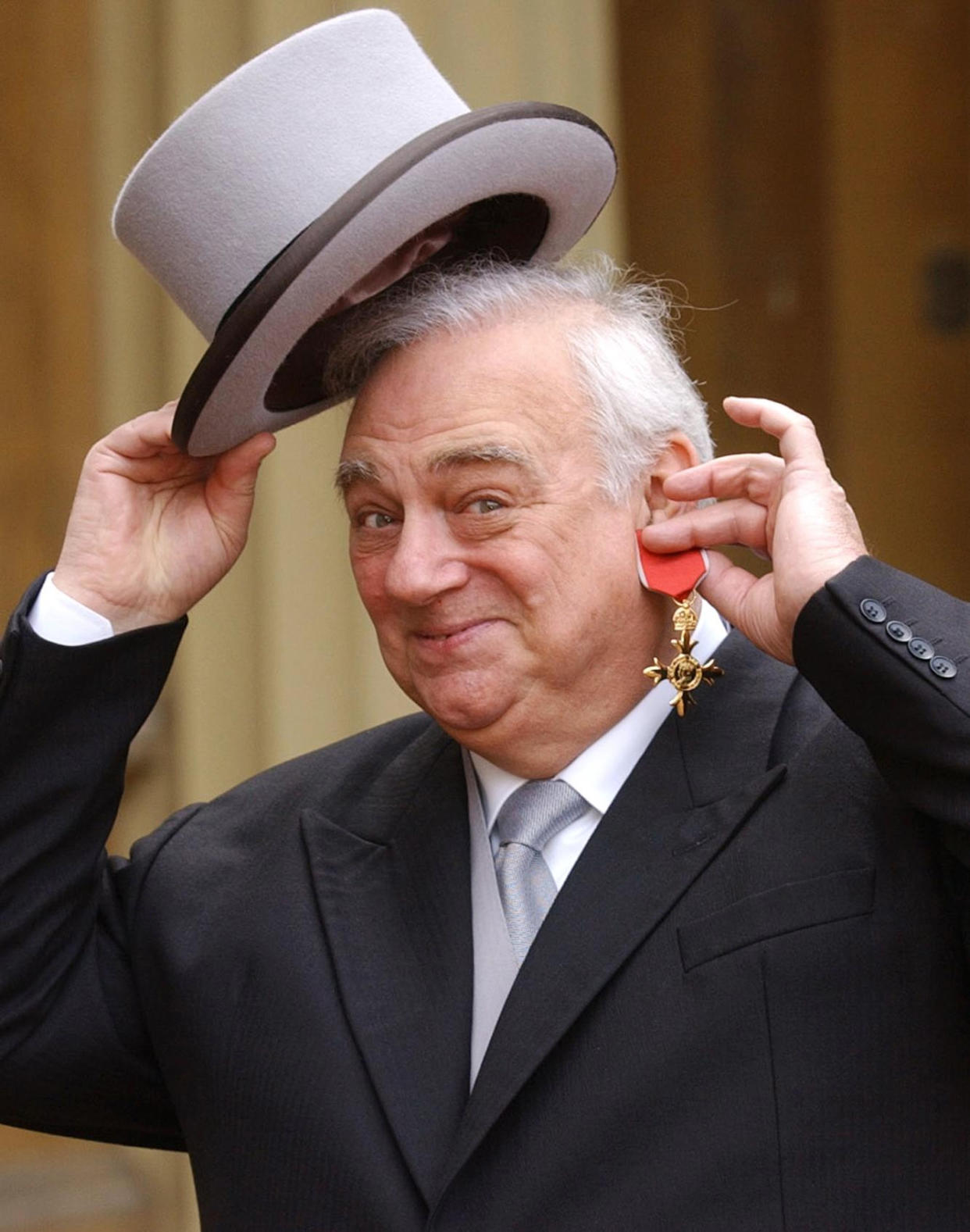 Comedian Roy Hudd holds his OBE for services to entertainment, at Buckingham Palace, London. Born in Croydon, Surrey, in 1936, Hudd started out as a Red Coat at Clacton on the Essex coast, alongside Harry Webb who later found fame and fortune as Cliff Richard.