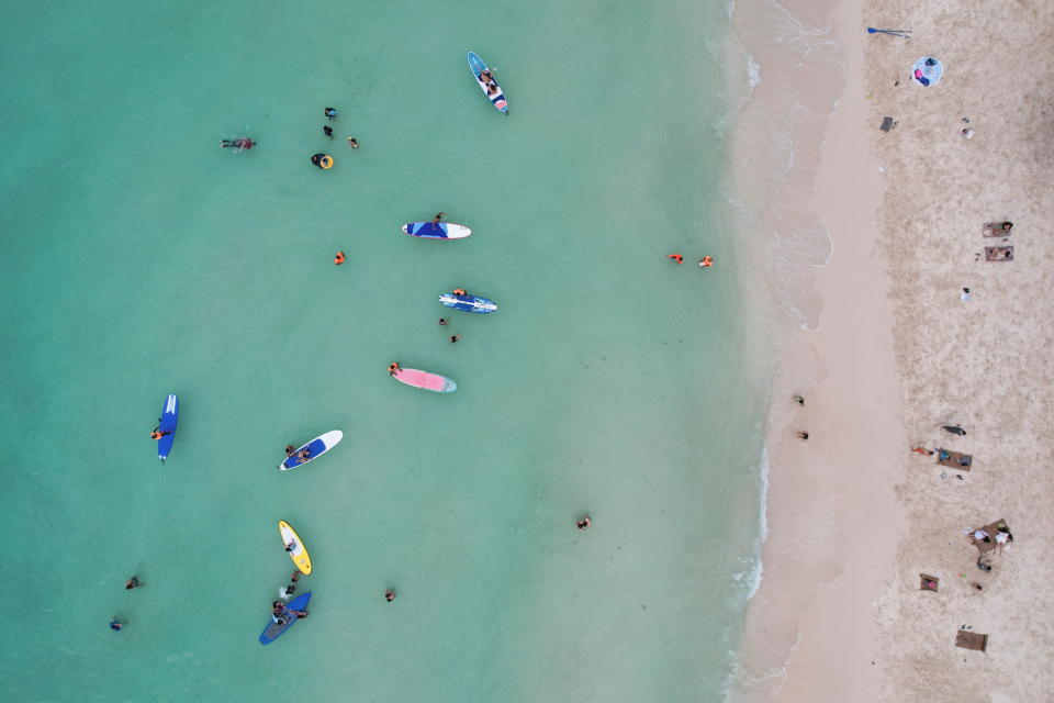 People relax along White Beach amid the coranavirus disease (COVID-19) outbreak, in Boracay Island, Aklan province, Philippines, December 1, 2021. Picture taken December 1, 2021. Picture taken with drone. REUTERS/Eloisa Lopez