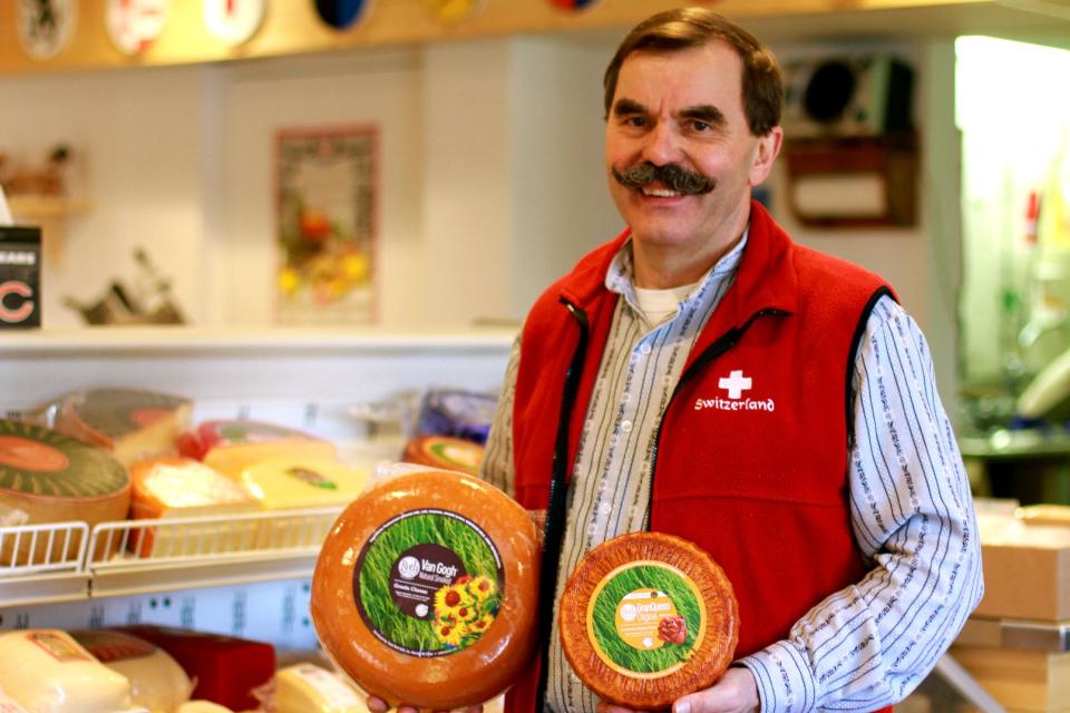 This April 19, 2013 photo shows owner Tony Zgraggen posing for a photo at the Alp and Dell artisanal cheese store in Monroe, Wis. The store is one of the few places in the area where Limburger cheese, famous for its smell, can be bought. (AP Photo/Niamh O'Neill-Culhane)