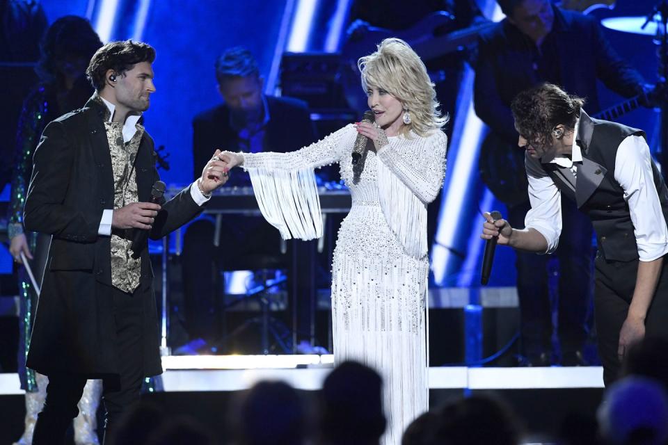 <p>This glorious gown highlights Dolly at her best in a sparkling, all-white ensemble worn at the 53rd Annual CMA Awards in 2019. As much as sparkles have become a hallmark of the singer's style, her big heart has become a hallmark of her legacy that is sure to endure for generations. </p>