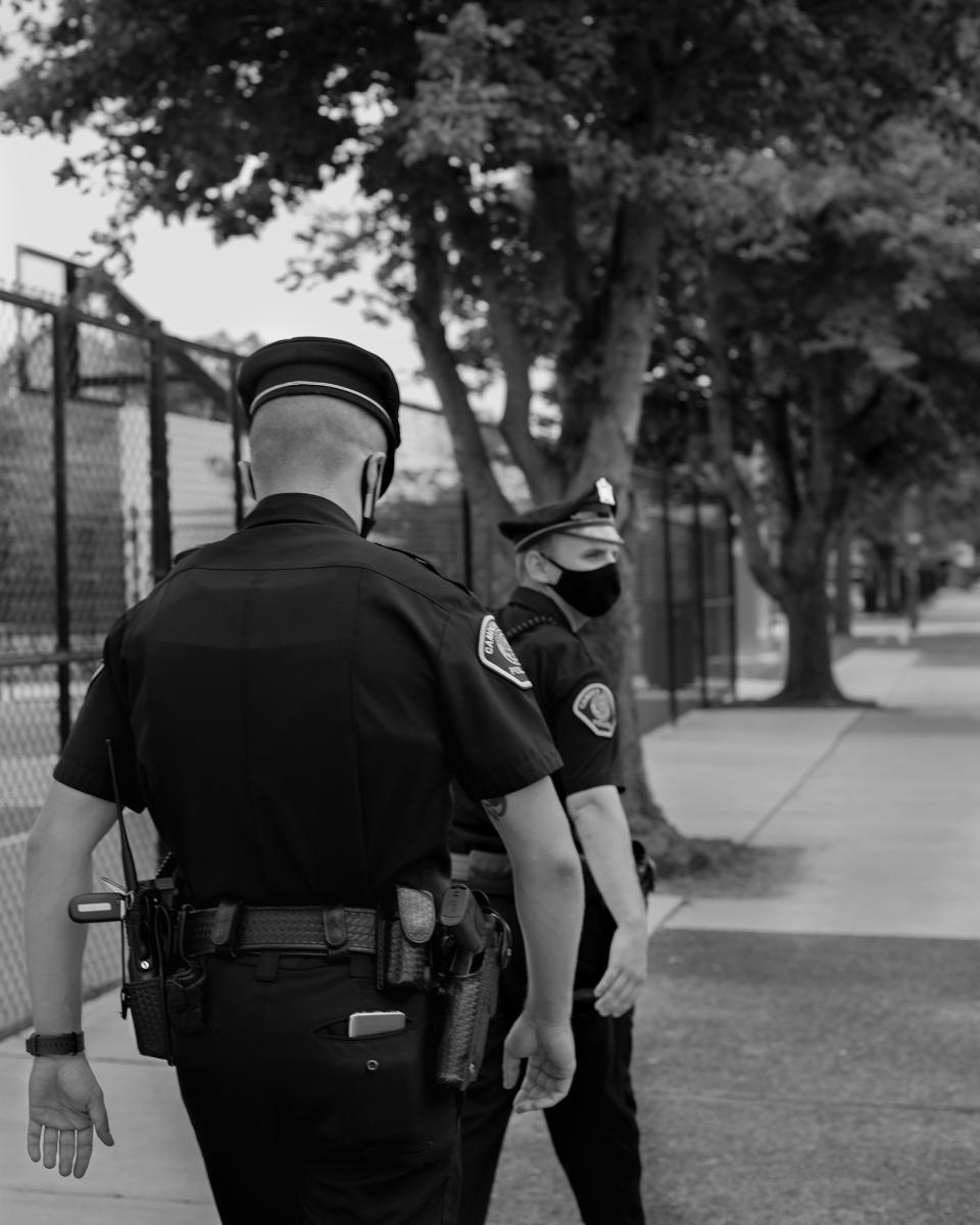 In 2013, when the Camden Police department relaunched under county control, it had two main objectives: reduce the crime rate, and make citizens feel safer. Above, two officers patrol the streets of the city on July 17. | Widline Cadet for TIME