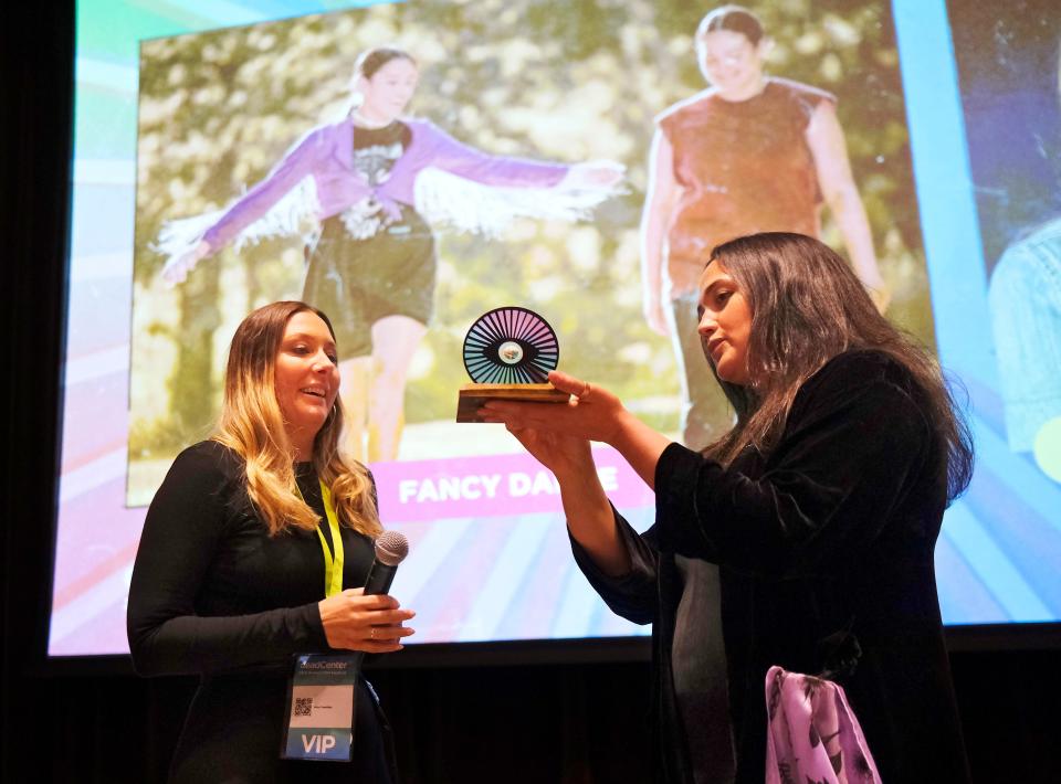 Lily Gladstone, star of "Fancy Dance," presents the deadCenter Film Icon Award to writer-director Erica Tremblay during the 2023 deadCenter Film Festival closing-night screening of "Fancy Dance" at the First Americans Museum, Sunday, June 11, 2023.