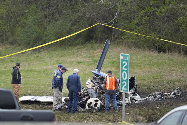 <p>AP Photo/George Walker IV</p> Investigators were seen viewing the plane's wreckage on Tuesday