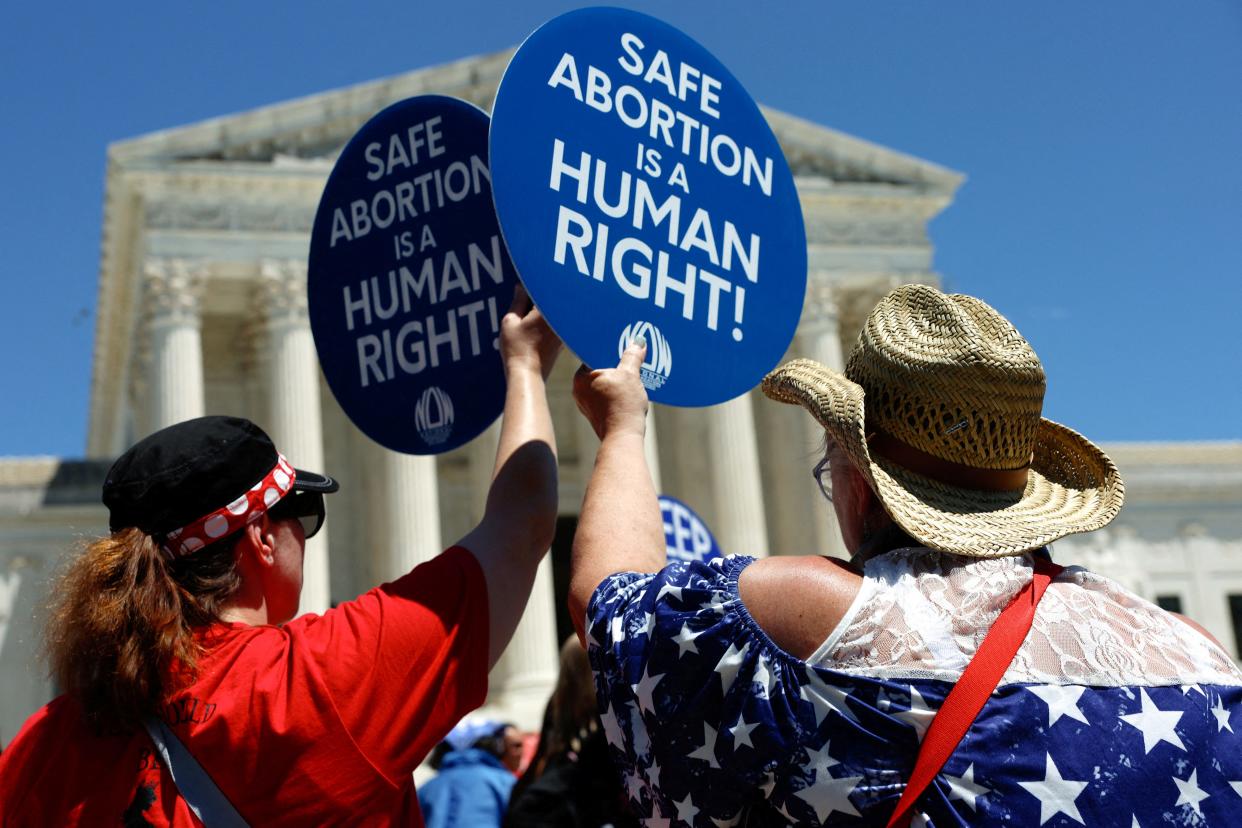 Abortion rights activists hold signs as they gather at the U.S. Supreme Court in Washington, D.C., on June 24, 2024, to mark the second anniversary of the Court overturning Roe v. Wade.