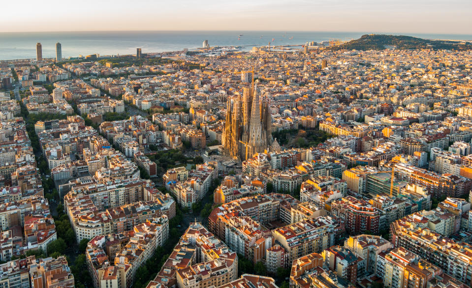 Sagrada Familia and Barcelona skyline at sunrise. (Photo: Gettyimages)