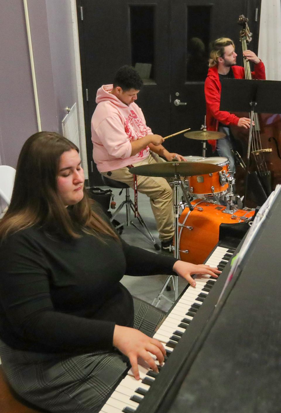 A University of Akron jazz trio with Susan Groggs on piano, Makyah Stergis on drums and Christian Elder playing bass accompany UA dancers in a rehearsal of "Dance Sonata" at Guzzetta Hall in Akron.