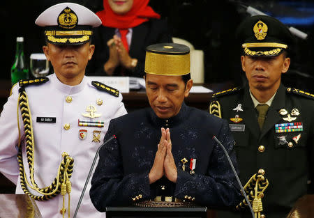 Indonesia president Joko Widodo gestures after delivering a speech in front of parliament members ahead of Thursday's independence day in Jakarta, Indonesia, August 16, 2017. REUTERS/Beawiharta