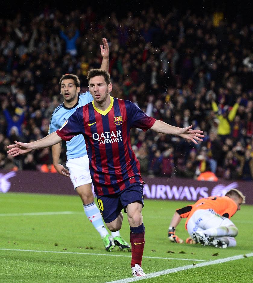 FC Barcelona's Lionel Messi, from Argentina, reacts after scoring against Celta Vigo during a Spanish La Liga soccer match at the Camp Nou stadium in Barcelona, Spain, Wednesday, March 26, 2014. (AP Photo/Manu Fernandez)