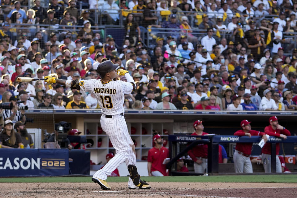 San Diego Padres' Manny Machado watches his home run during the seventh inning in Game 2 of the baseball NL Championship Series between the San Diego Padres and the Philadelphia Phillies on Wednesday, Oct. 19, 2022, in San Diego. (AP Photo/Brynn Anderson)