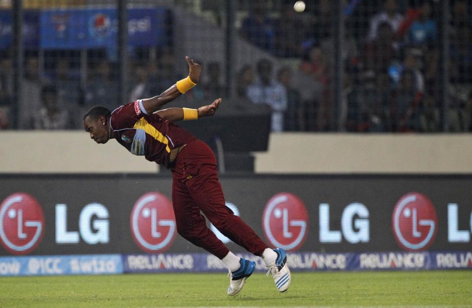 West Indies's Dwayne Bravo throws the ball after catching successfully to dismiss Sri Lanka's Angelo Mathews during their ICC Twenty20 Cricket World Cup semi-final match in Dhaka, Bangladesh, Thursday, April 3, 2014.(AP Photo/A.M. Ahad)