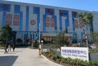 FILE PHOTO: A worker stands outside a factory of Contemporary Amperex Technology Ltd (CATL) in Ningde