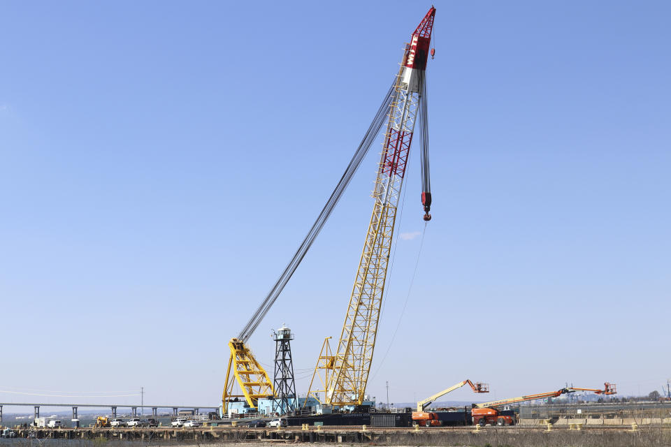 FILE - The Chesapeake 1000 crane, which will be used to help remove wreckage from the collapse of the Key Bridge, is docked at Tradepoint Atlantic in Sparrows Point, Md., March 29, 2024. The floating crane that’s been hauling away shattered steel from the collapsed Baltimore bridge played a much different role during the Cold War. (AP Photo/Brian Witte, File)