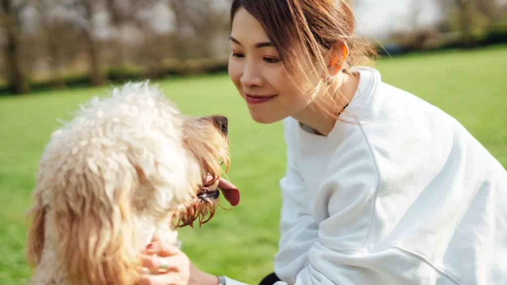 Young woman living with emotional support dog. Having an ESA dog with a verified ESA letter can improve mental health and wellbeing.