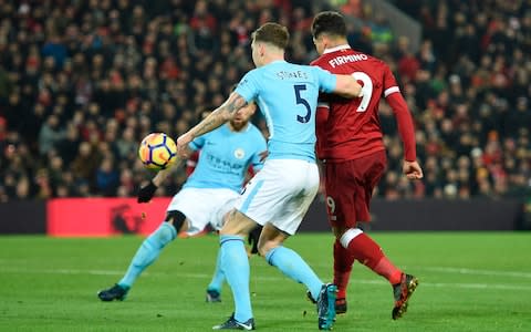 Firmino chipped home Liverpool's second goal - Credit: AFP