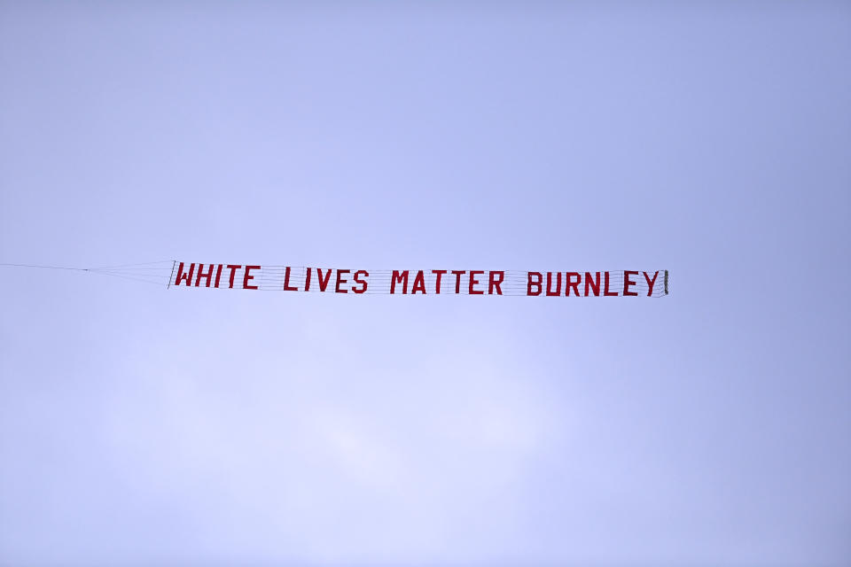 MANCHESTER, ENGLAND - JUNE 22: A plane flies over the stadium with a banner reading 'White Lives Matter Burnley'  during the Premier League match between Manchester City and Burnley FC at Etihad Stadium on June 22, 2020 in Manchester, England. Football stadiums around Europe remain empty due to the Coronavirus Pandemic as Government social distancing laws prohibit fans inside venus resulting in all fixtures being played behind closed doors. (Photo by Shaun Botterill/Getty Images)