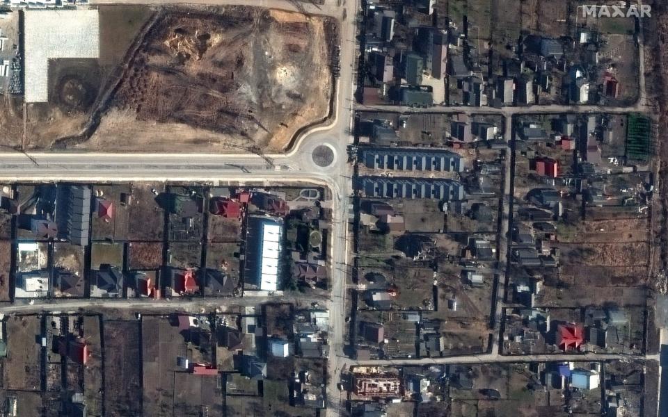 A handout satellite image made available by Maxar Technologies shows what appears to be the bodies of several civilians along Yablonska Street in Bucha, Ukraine, 19 March 2022 (issued 5 April 2022). - Maxar Technologies Handout/Shutterstock