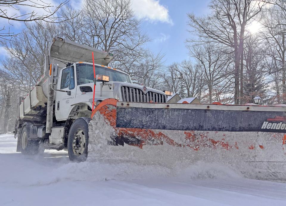 A City of Mansfield snow plow driver clears the snow from Forest Hill Road on Tuesday morning. Following predicted snowfall through Friday evening, the weekend temperatures will be cold but relatively bearable. The highs will be 24 on Friday, 17 Saturday and 21 Sunday.