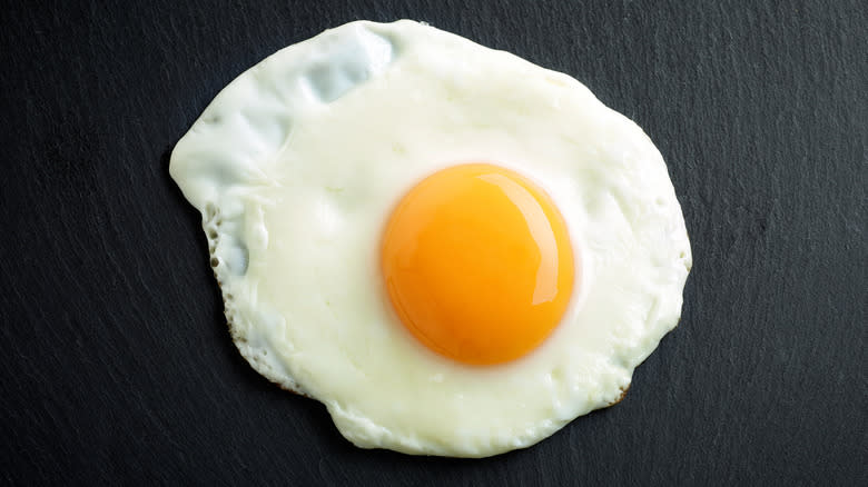 fried egg on black surface