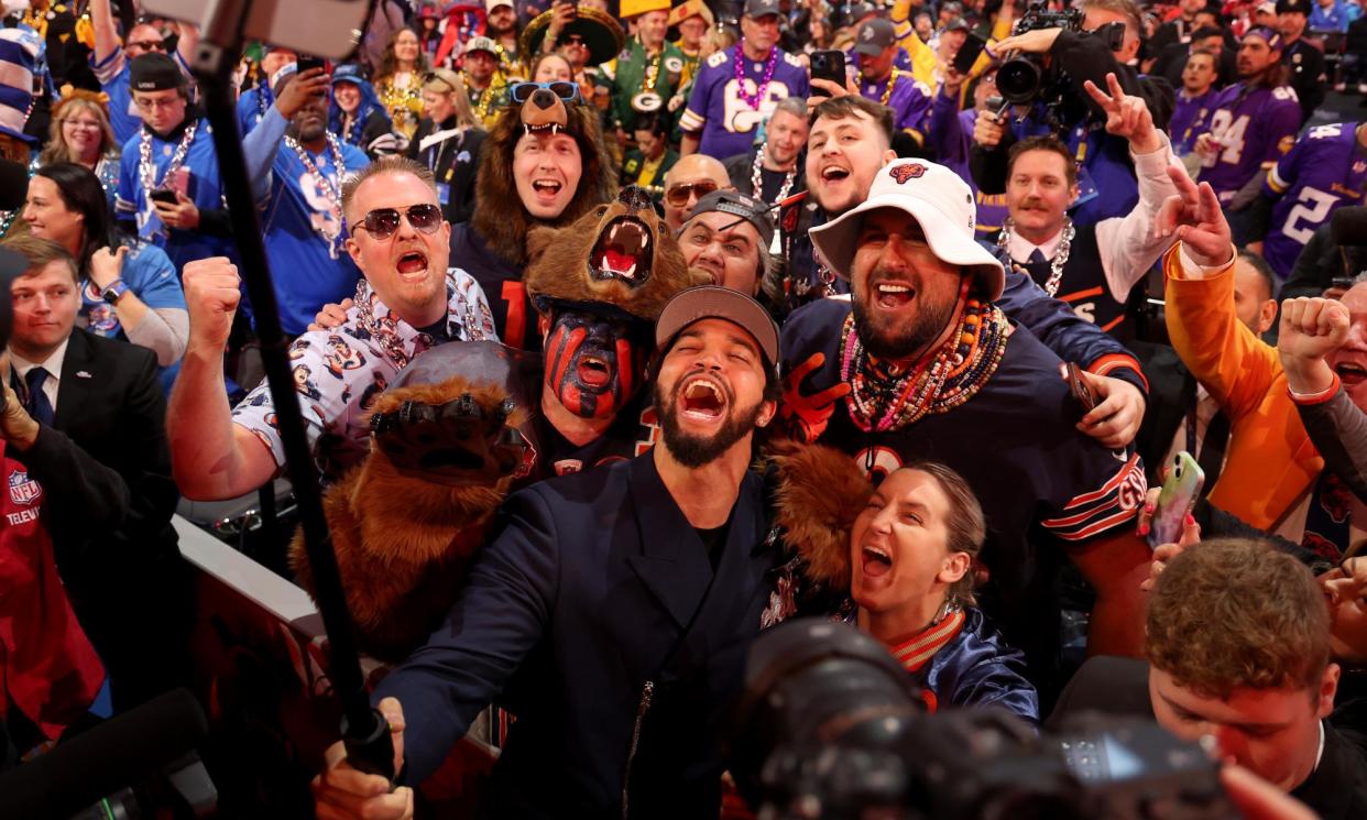 <span>Caleb Williams celebrates with Bears fans after being selected first overall by Chicago during the first round of the 2024 NFL draft on Thursday in Detroit.</span><span>Photograph: Gregory Shamus/Getty Images</span>