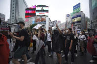 People march to protest during a solidarity rally for the death of George Floyd in Tokyo Sunday, June 14, 2020. Floyd died after being restrained by Minneapolis police officers on May 25. (AP Photo/Eugene Hoshiko)