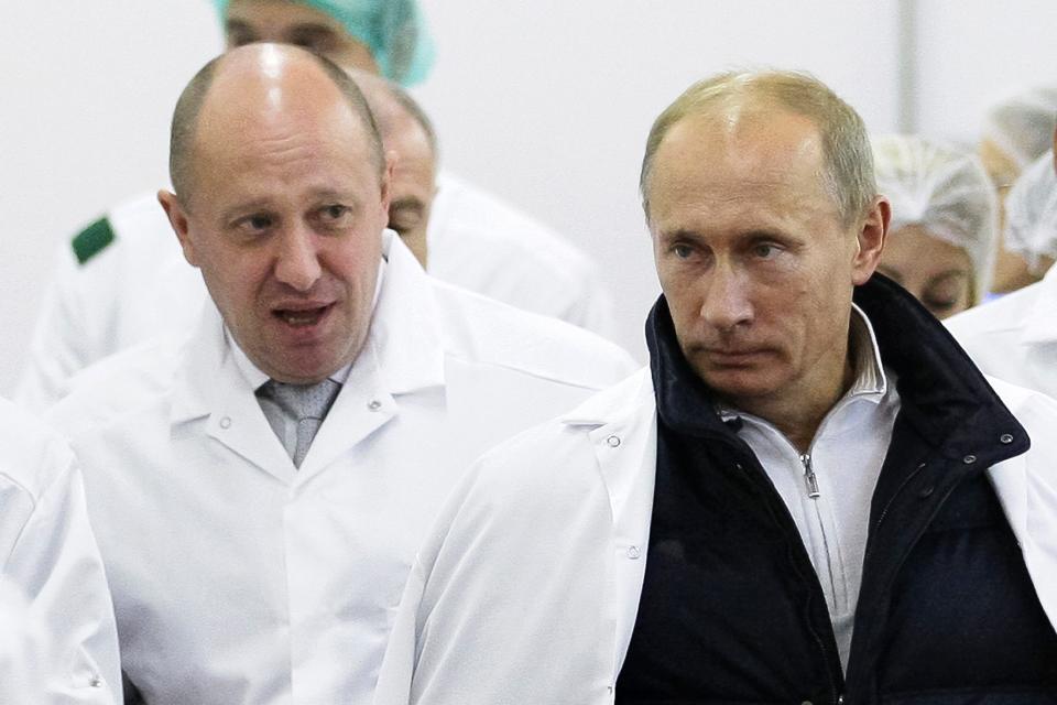 Wagner Group owner Yevgeny Prigozhin (left, with Russian President Vladimir Putin) made the announcement in a video released on Sunday (AP)