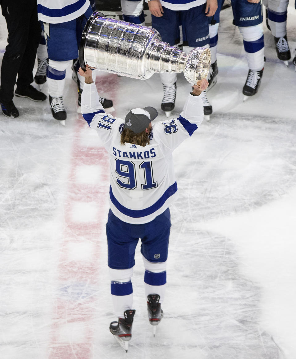 Tampa Bay Lightning's Steven Stamkos (91) hoists the Stanley Cup after defeating the Dallas Stars in the NHL Stanley Cup hockey finals, in Edmonton, Alberta, on Monday, Sept. 28, 2020. (Jason Franson/The Canadian Press via AP)