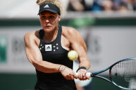 France's Leolla Jeanjean plays a shot against Karolina Pliskova of the Czech Republic during their second round match at the French Open tennis tournament in Roland Garros stadium in Paris, France, Thursday, May 26, 2022. (AP Photo/Thibault Camus)