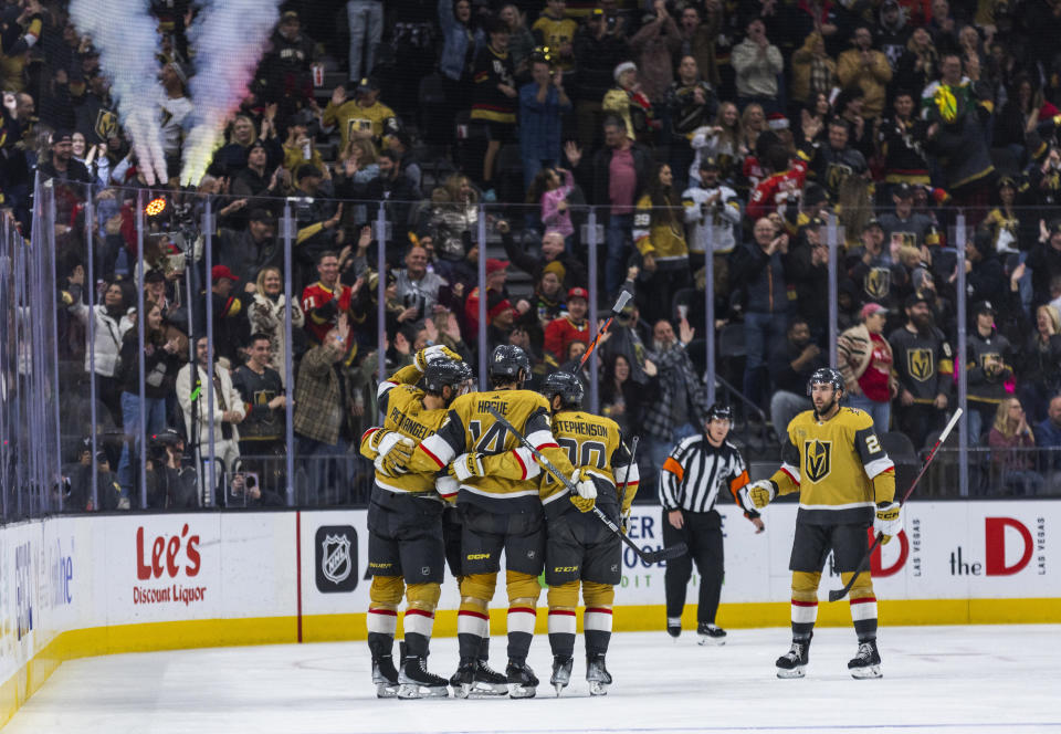 Vegas Golden Knights celebrate a goal against the St. Louis Blues during the first period of an NHL hockey game Friday, Dec. 23, 2022, in Las Vegas. (AP Photo/L.E. Baskow)