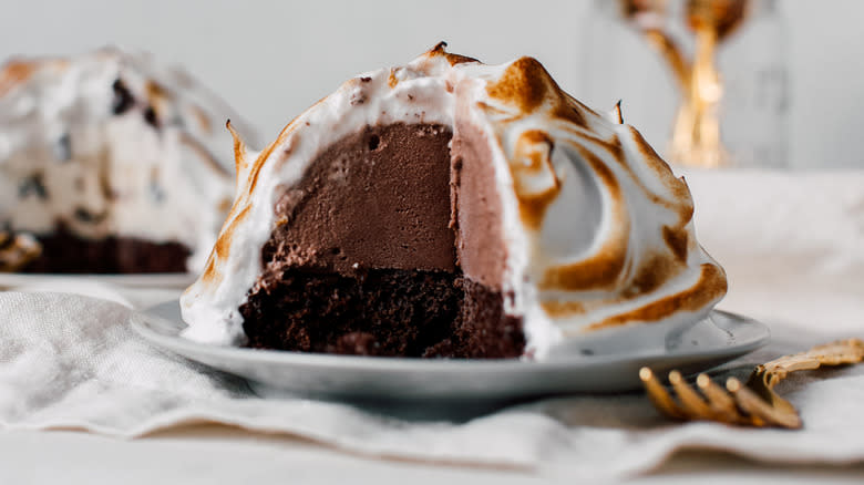 Sliced baked Alaska on plate