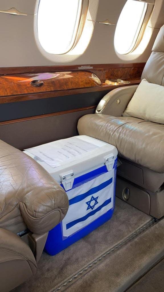 A cooler bearing the Israeli flag sits between seats on a private jet bound for the United Arab Emirates, where in a matter of hours it will be implanted into an ailing Arab mother in Abu Dhabi. The kidney was part of a historic cyclic exchange involving two adults in the UAE and four in Israel, with logistics provided by the Alliance for Paired Kidney Donation, a non-profit based in Toledo, Ohio.