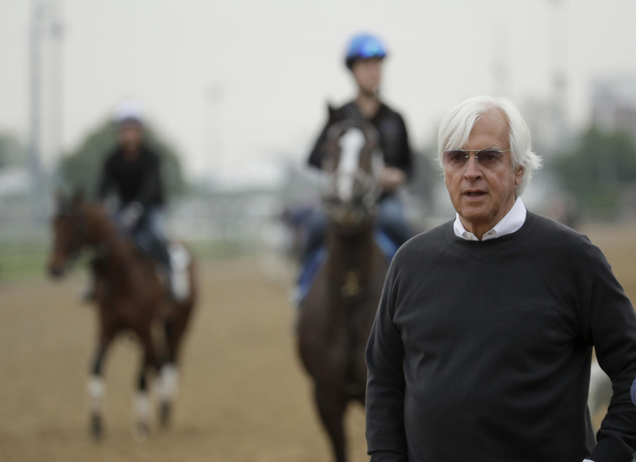 Trainer Bob Baffert, who has three Kentucky Derby hopefuls, watches on the track during a workout at Churchill Downs Tuesday, April 30, 2019, in Louisville, Ky. The 145th running of the Kentucky Derby is scheduled for Saturday, May 4. (AP Photo/Charlie Riedel)