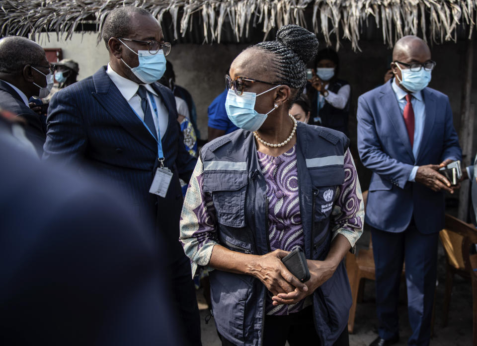 Dr. Matshidiso Moeti, the first woman to lead the the World Health Organization's regional Africa office, joins Congo's health minister Gilbert Mokoki on a field trip in Brazzaville, Congo, Wednesday, Feb. 9, 2022. Elections, coups, disease outbreaks and extreme weather are some of the main events that occurred across Africa in 2022. Experts say the climate crisis is hitting Africa “first and hardest.” Kevin Mugenya, a senior food security advisor for Mercy Corps said the continent of 54 countries and 1.3 billion people is facing “a catastrophic global food crisis” that “will worsen if actors do not act quickly.” (AP Photo/Moses Sawasawa)