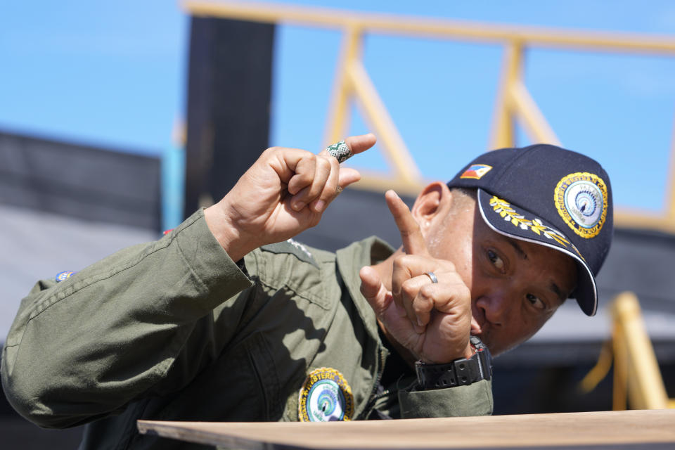 Western Command chief Vice-Admiral Alberto Carlos of the Philippine Navy gestures as he talks to reporters in Palawan province, southern Philippines on Wednesday, March 6, 2024, after the Unaizah May 4 was hit by Chinese coast guard water canon blast on Tuesday during their resupply mission at South China Sea. Chinese and Philippine coast guard vessels collided in the disputed South China Sea and four Filipino crew members were injured in high-seas confrontations Tuesday as Southeast Asian leaders gathered for a summit that was expected to touch on Beijing's aggression at sea. (AP Photo/Aaron Favila)