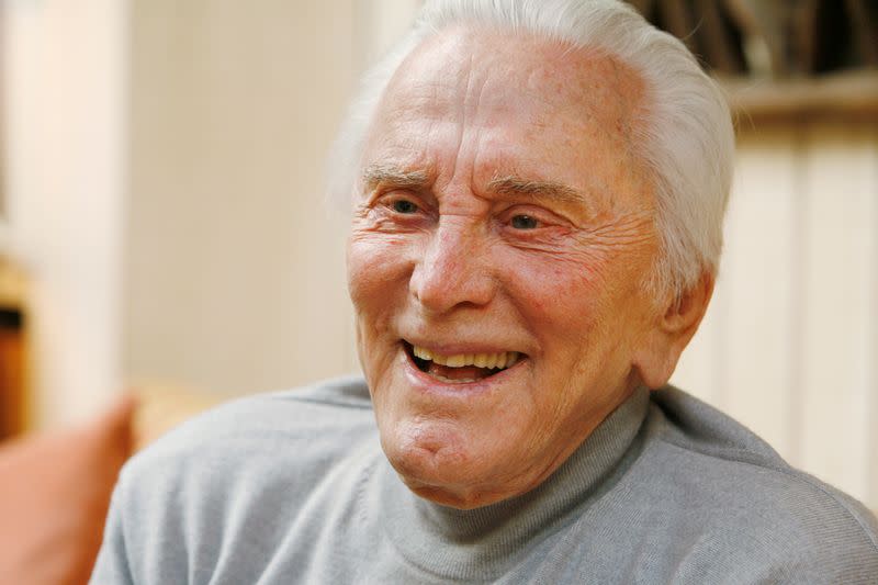 FILE PHOTO: Actor Kirk Douglas, 90, is photographed during an interview about his life, film career and his new book "Let's Face It," at his home in Beverly Hills, California