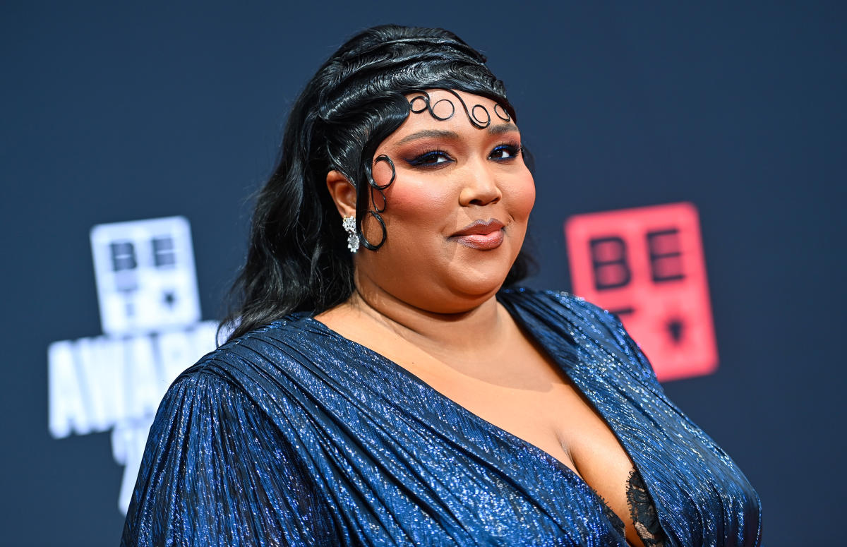 Lizzo twerks in a colorful faux fur bikini