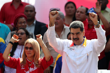 Venezuela's President Nicolas Maduro and his wife Cilia Flores greet people during a rally in support of the government in Caracas, Venezuela May 20, 2019. REUTERS/Ivan Alvarado
