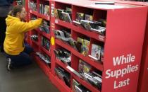 A shopper looks over the selection movies and video games for sale at Walmart on Black Friday in Broomfield, Colorado November 28, 2014. REUTERS/Rick Wilking